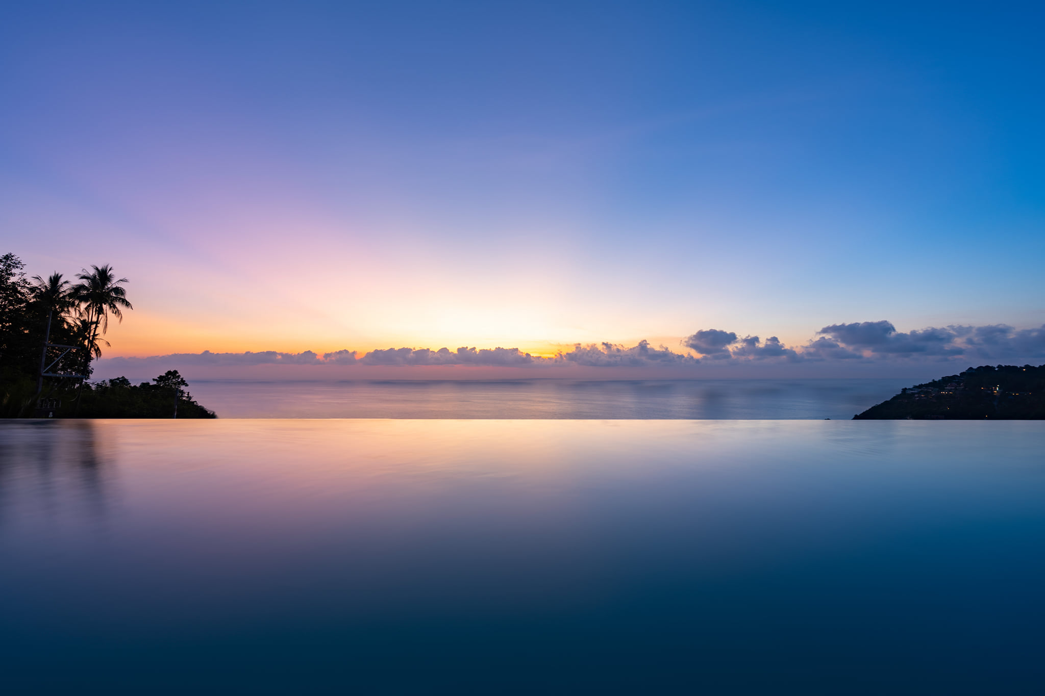 Villa 369 Koh Samui — infinity pool merging with ocean at sunset blue hour
